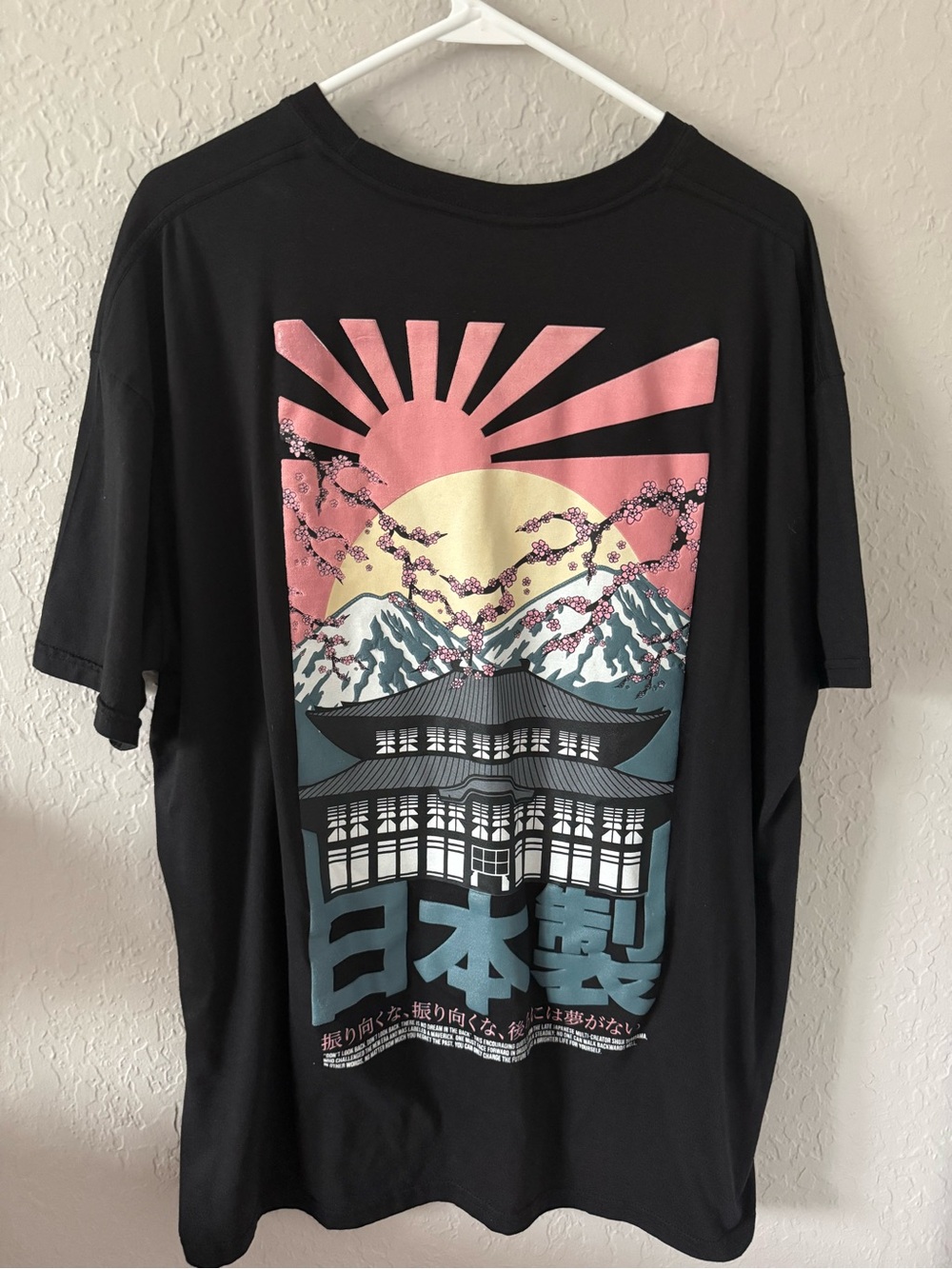 Black Graphic Tee with Pink Sunrise and Blue Accents by